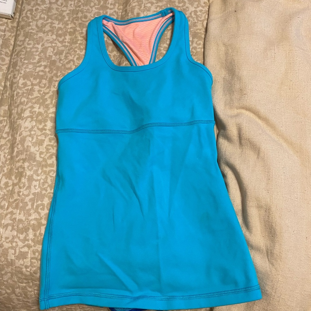 Ivivva light blue tank top in great condition. Has a built in bra.